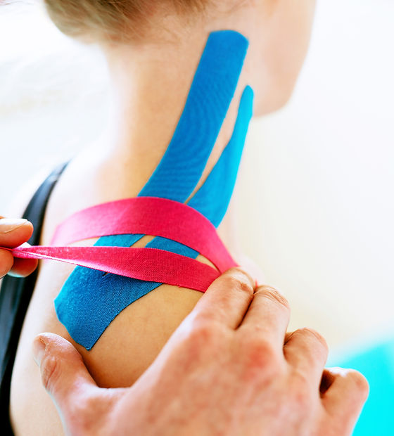 Kinesiotaping. Physical therapist applyi